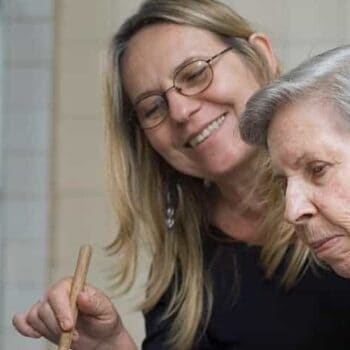 older woman and younger woman cooking together