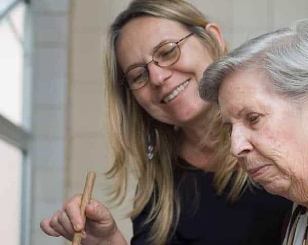 older woman and younger woman cooking together