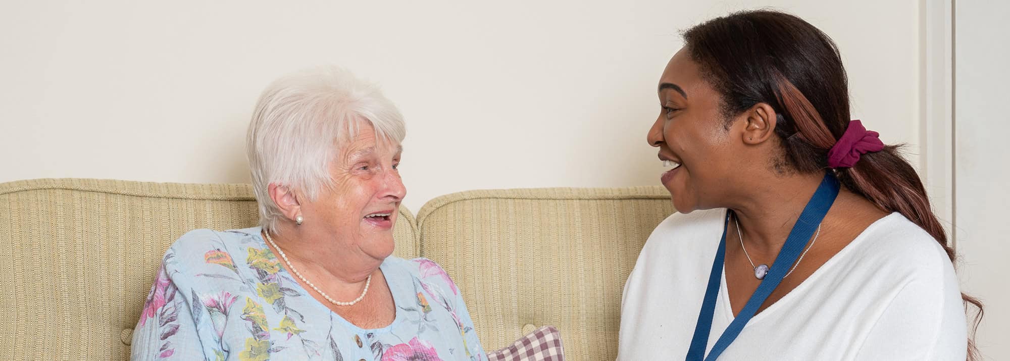 Elderly lady with her carer