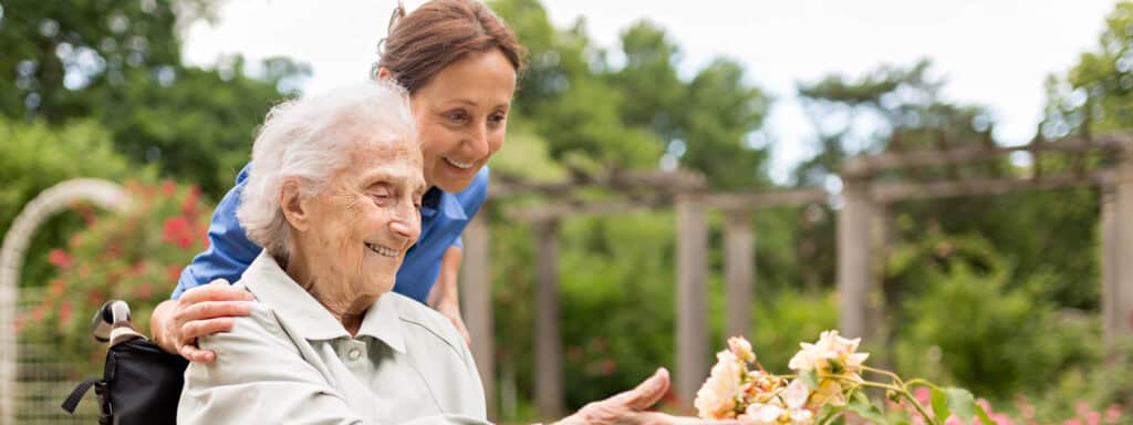 live-in carer and client in garden