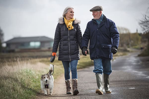 Wife walking with husband - living with dementia