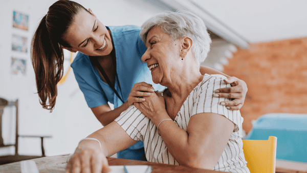 live-in carer helping senior lady