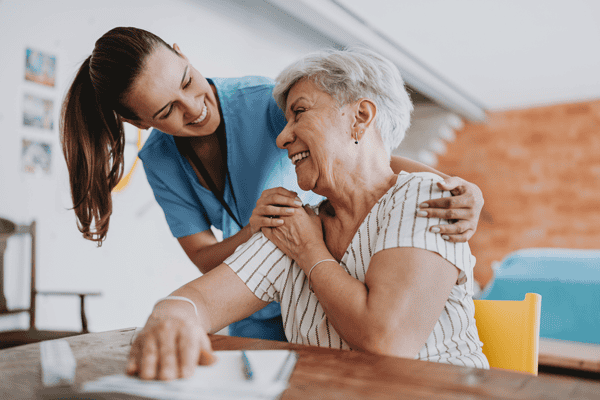 live-in carer helping senior lady